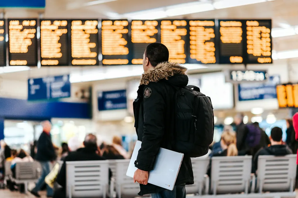 Traveller checking the departures board
