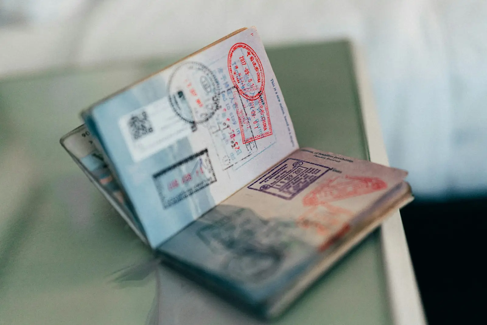 Open passport with entry stamps